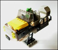 Boba Fett's junkyard airspeeder by green dewback